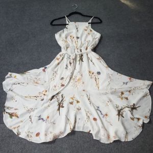 Midi dress in cream with flower print.